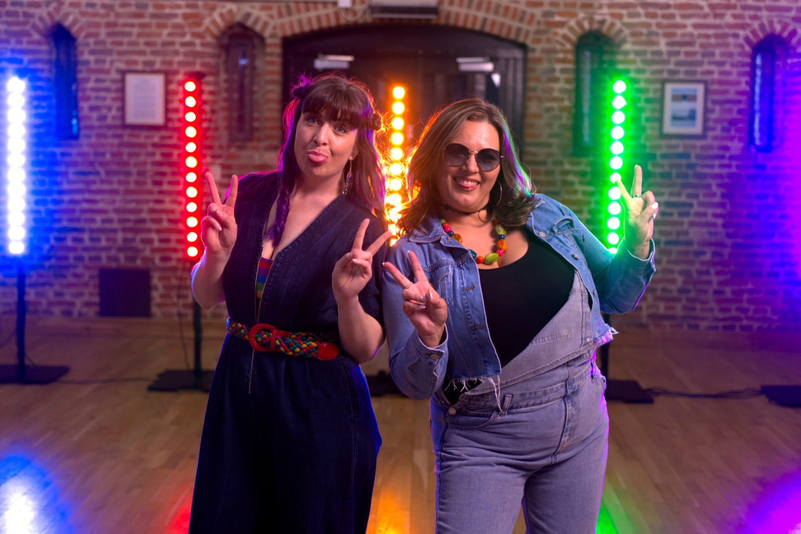 Chelsea and Anne-Marie making peace signs