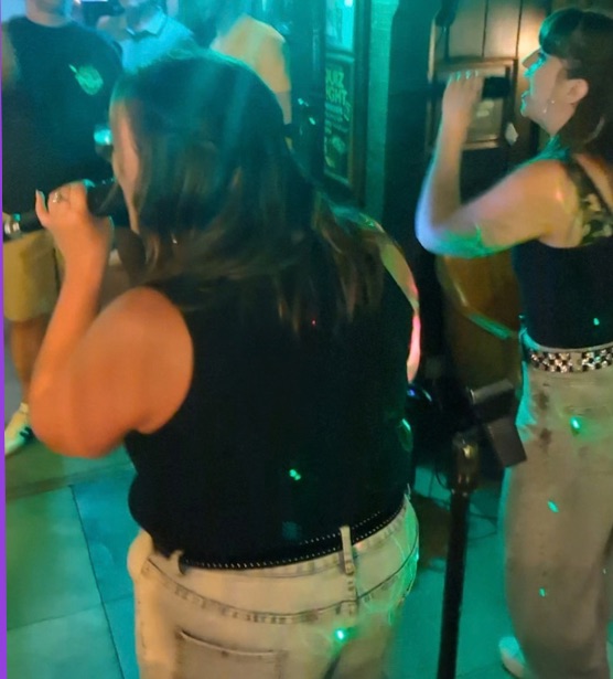 VHS singing in a busy bar